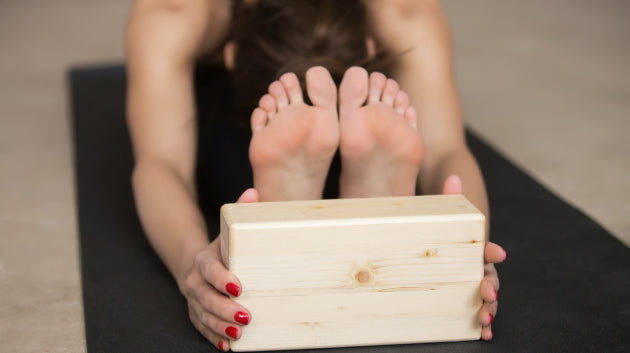 Quelles sont les postures à réaliser avec une brique de yoga ?