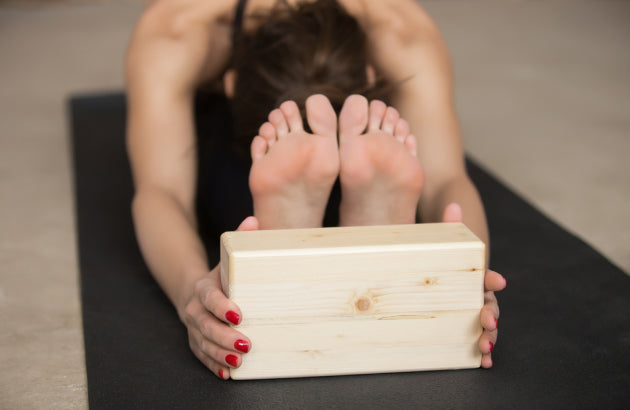 Quelles sont les postures à réaliser avec une brique de yoga ?